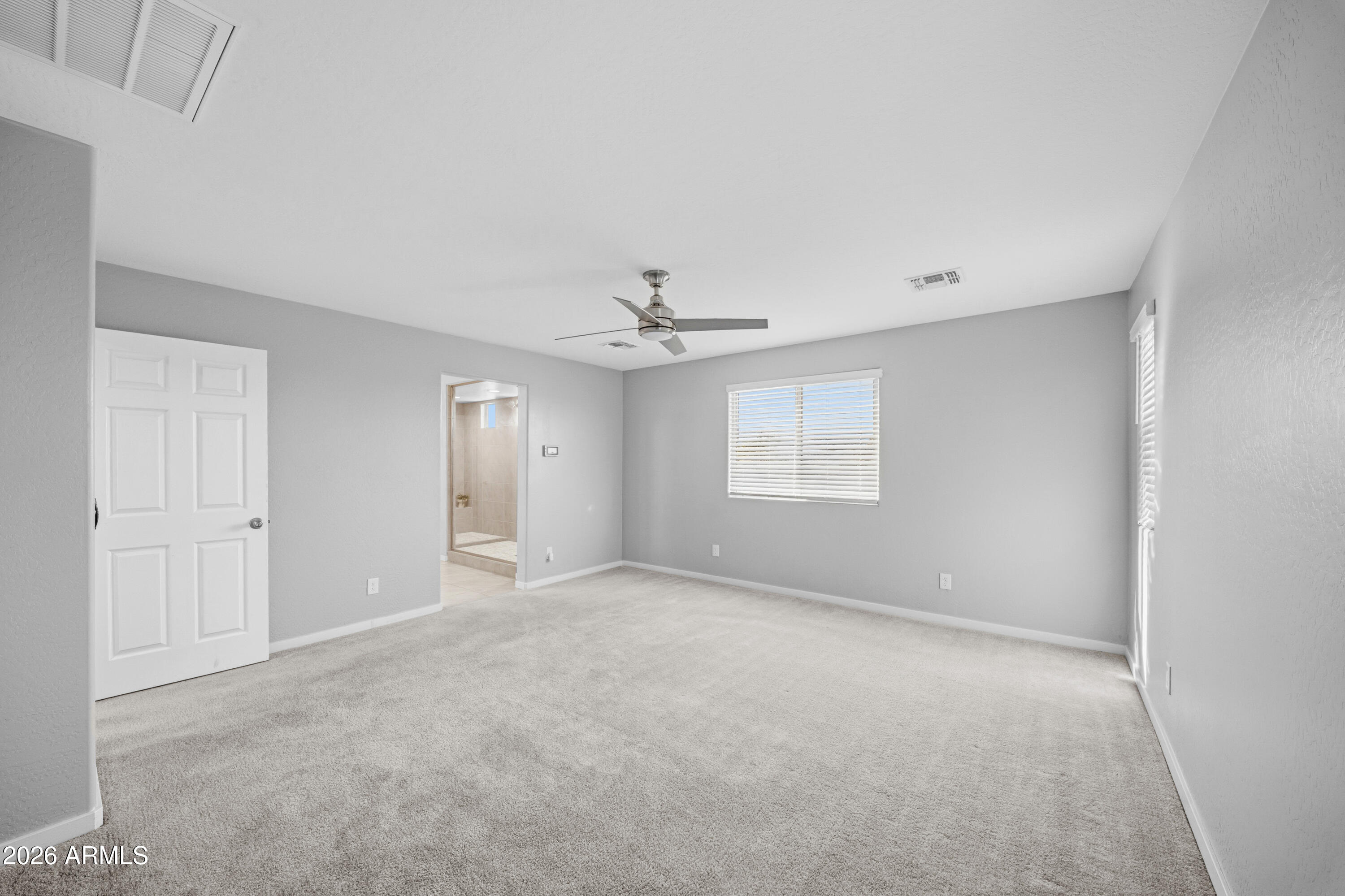 15754 West Madison Street Goodyear, AZ 85338 - Photo 21 of 35 a view of an empty room with a window