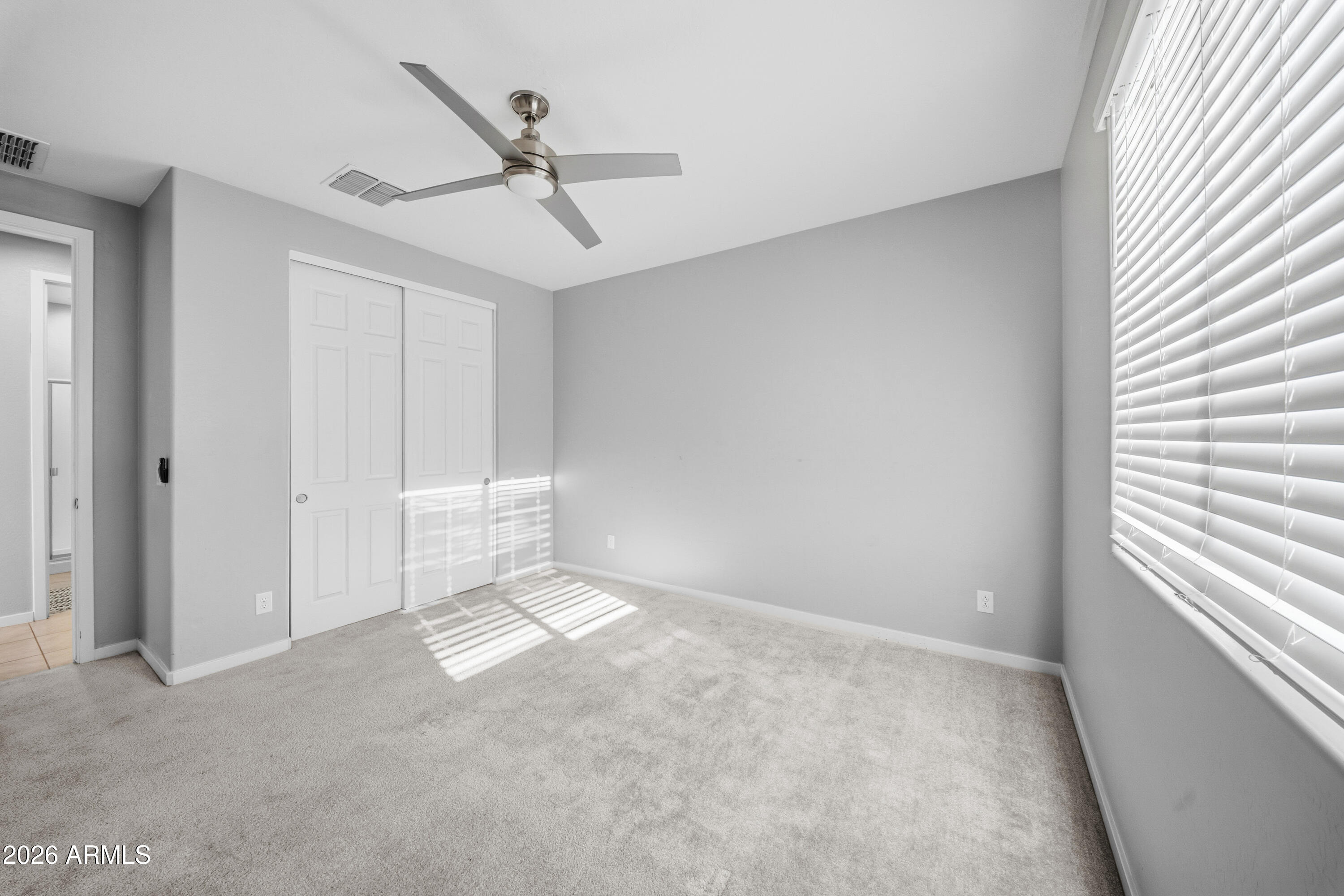 15754 West Madison Street Goodyear, AZ 85338 - Photo 30 of 35 a view of an empty room with a window