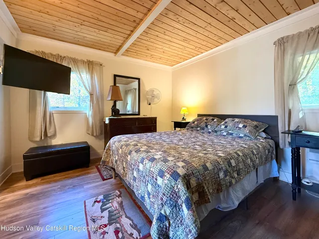 a view of a house with backyard porch and sitting area