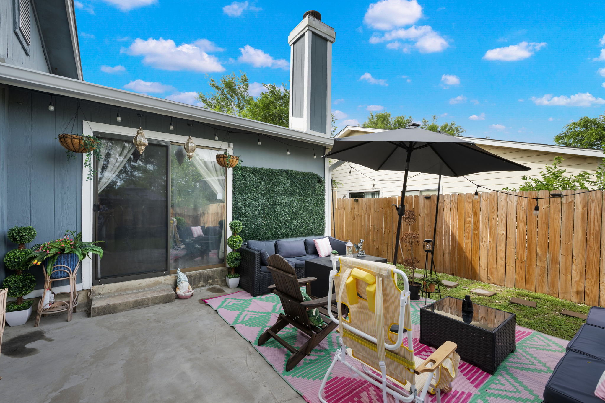 8317 Forest Ridge Drive San Antonio, TX 78239 - Photo 18 of 26 A well-appointed outdoor patio area provides a perfect space for relaxation and entertaining, complete with string lights for evening ambiance.