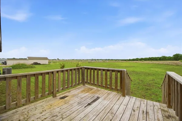 a view of deck with wooden floor and lake view