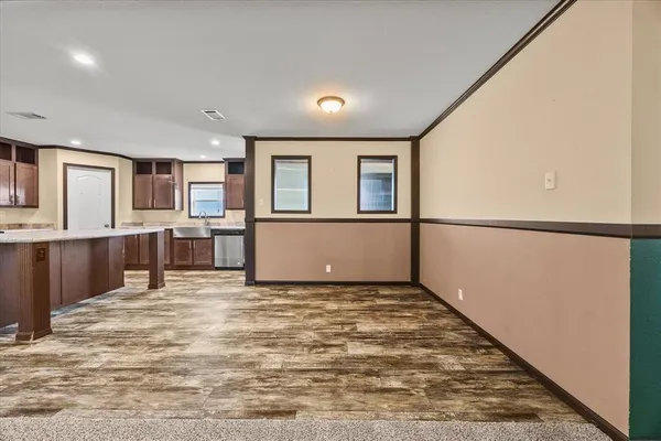 a view of a kitchen with a sink and cabinets