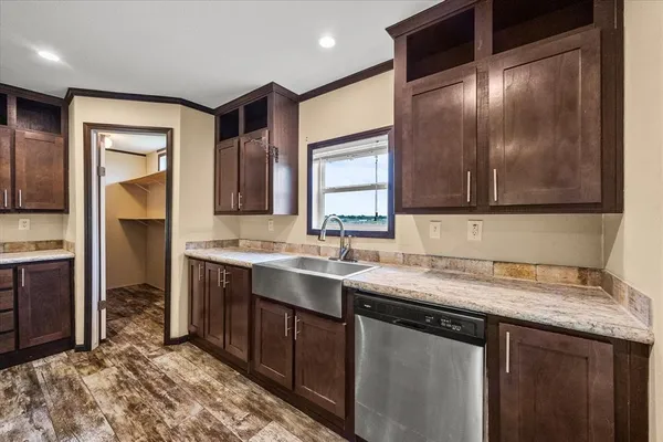 a kitchen with a sink and a refrigerator