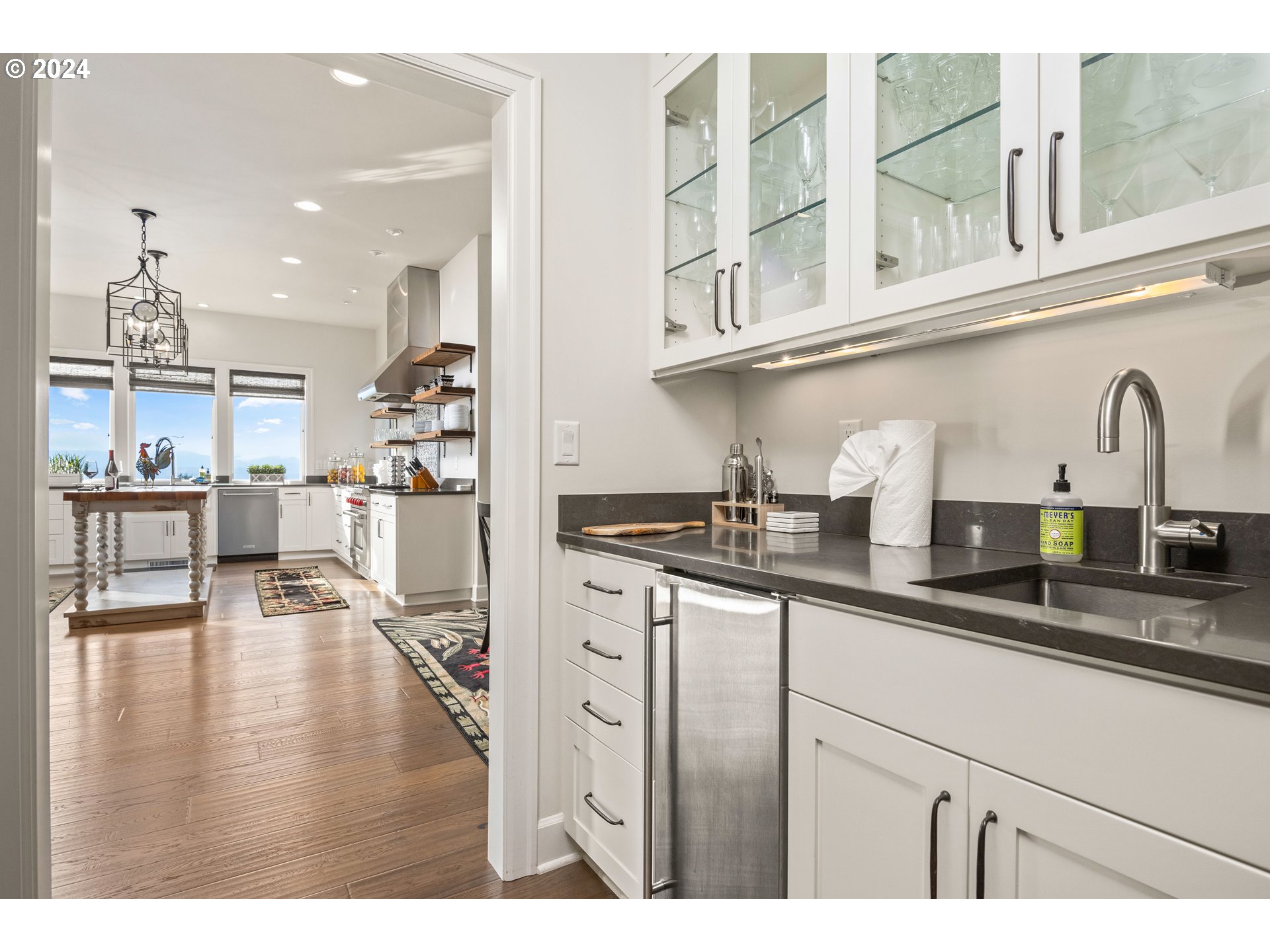 15680 Northeast Yamhill Road Yamhill, OR 97148 - Photo 14 of 47 a kitchen with stainless steel appliances granite countertop a sink dishwasher and cabinets with wooden floor