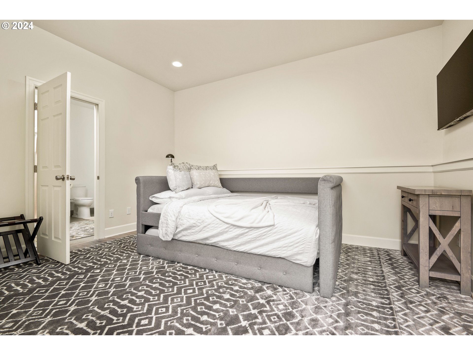 15680 Northeast Yamhill Road Yamhill, OR 97148 - Photo 16 of 47 a bedroom with a bed and a television