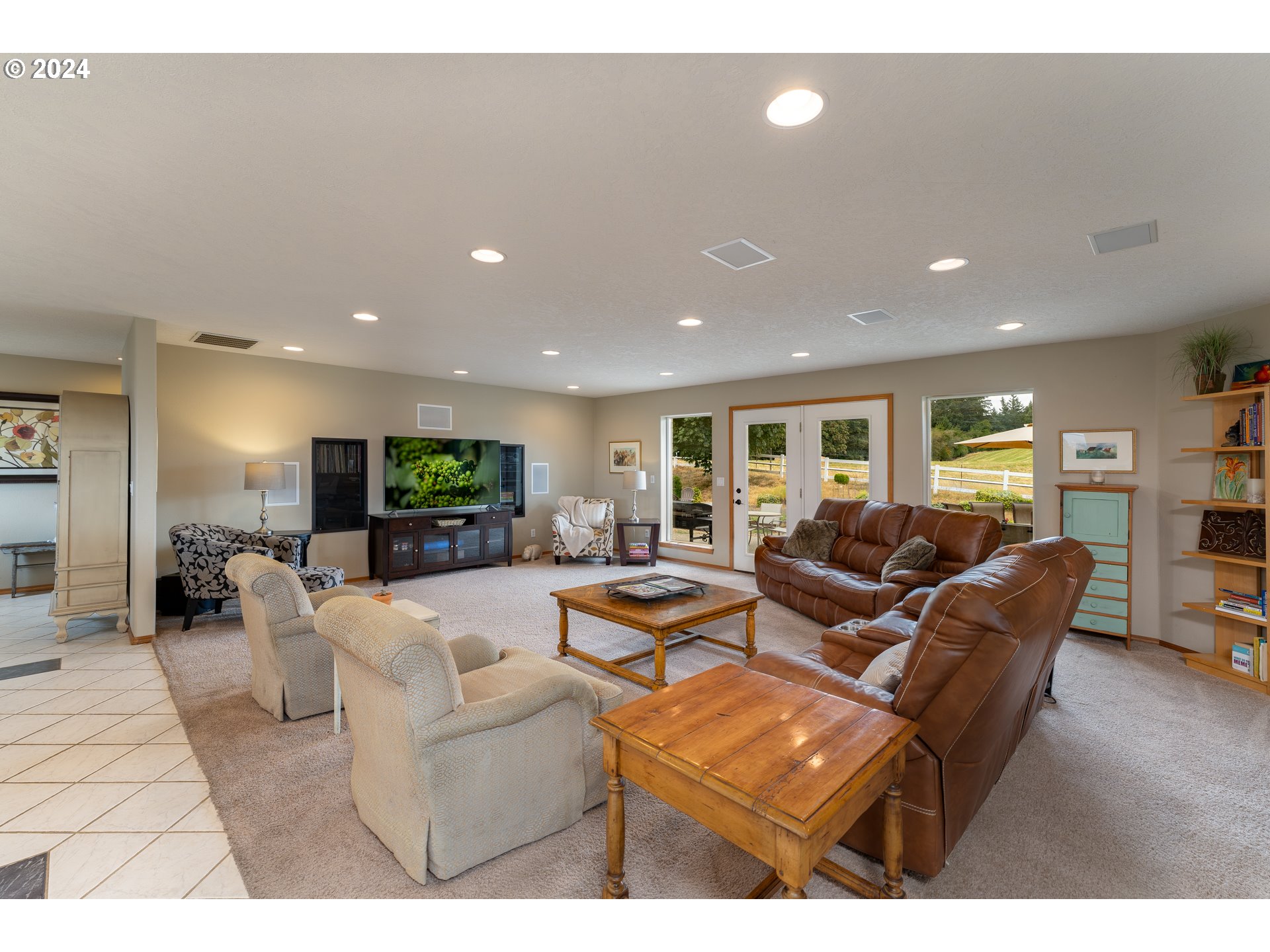 15680 Northeast Yamhill Road Yamhill, OR 97148 - Photo 20 of 47 a living room with furniture a flat screen tv and a fireplace