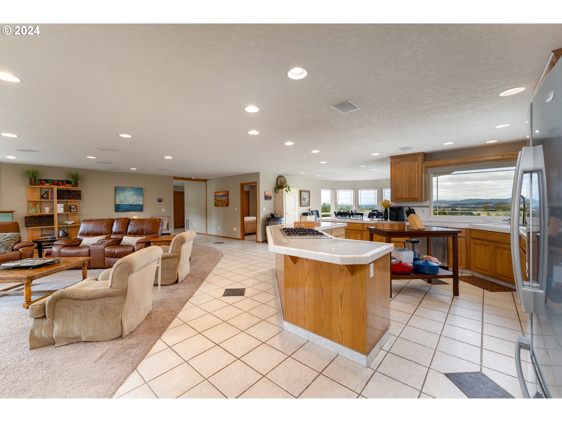 15680 Northeast Yamhill Road Yamhill, OR 97148 - Photo 21 of 47 a living room with stainless steel appliances kitchen island granite countertop a large kitchen counter top and stove