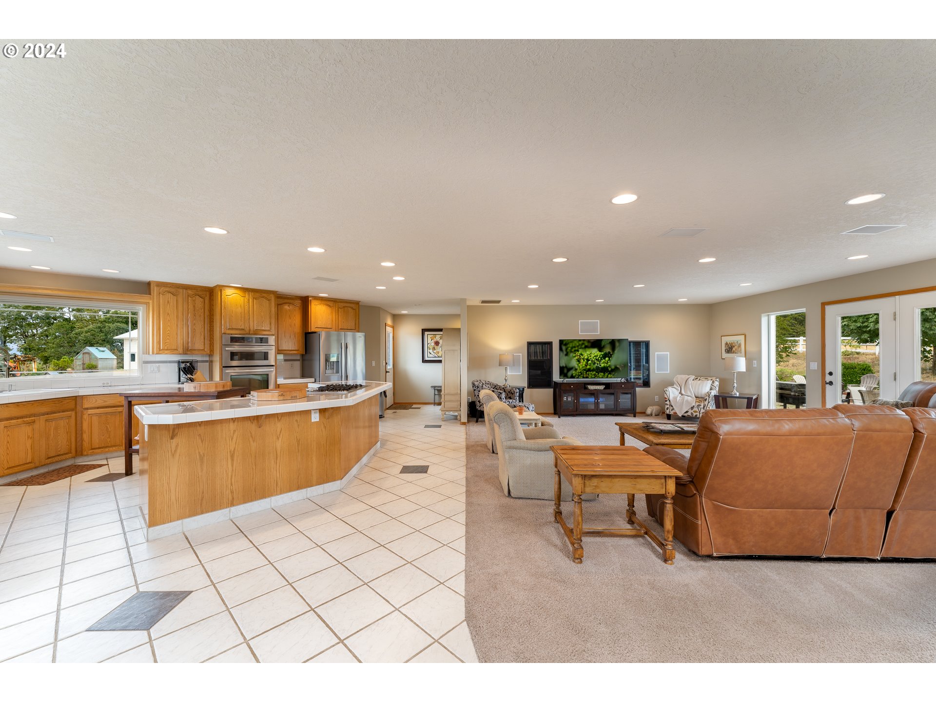 15680 Northeast Yamhill Road Yamhill, OR 97148 - Photo 22 of 47 a living room with furniture a flat screen tv and a large window