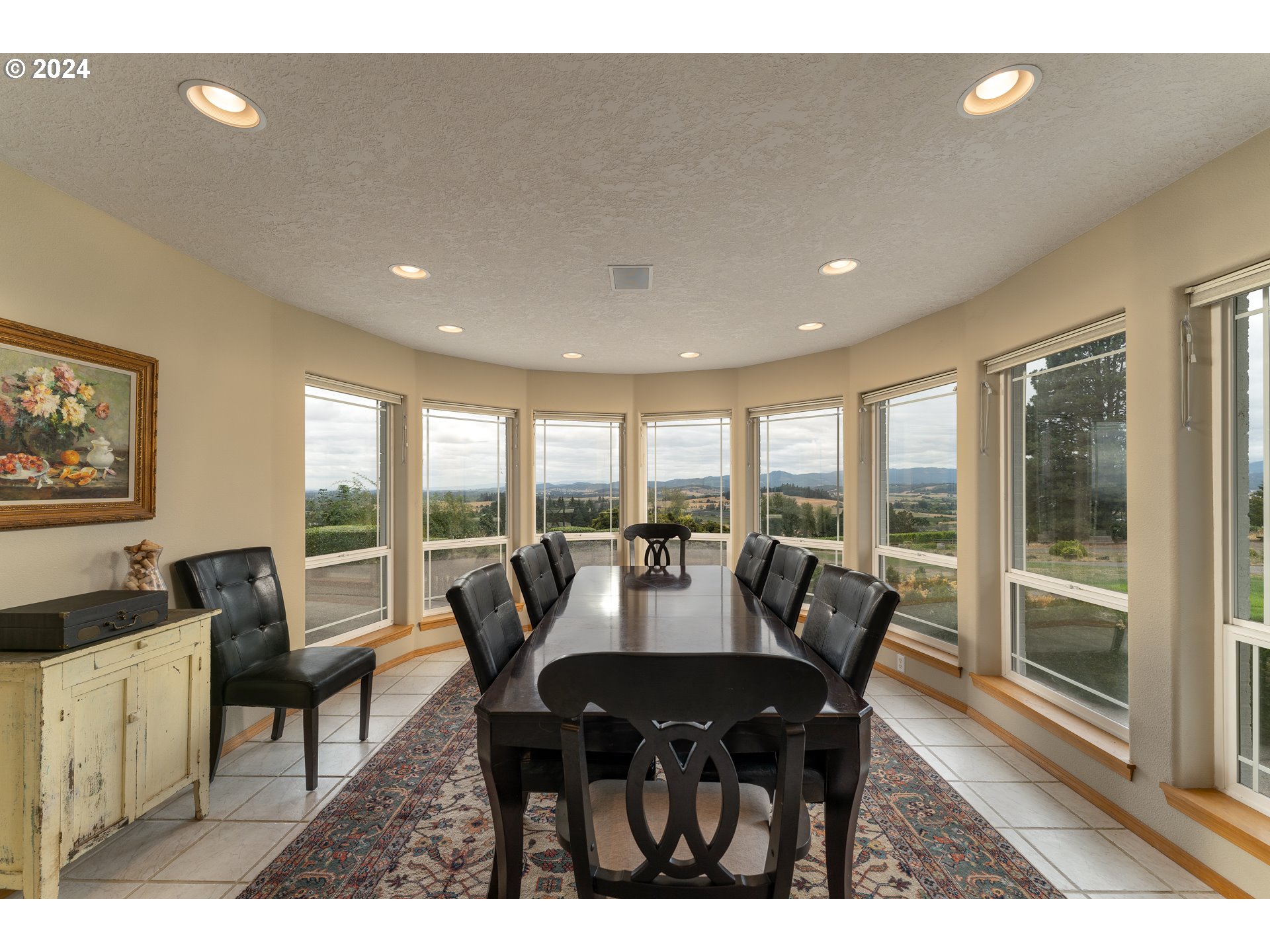 15680 Northeast Yamhill Road Yamhill, OR 97148 - Photo 25 of 47 a view of a dining room with furniture large windows and wooden floor