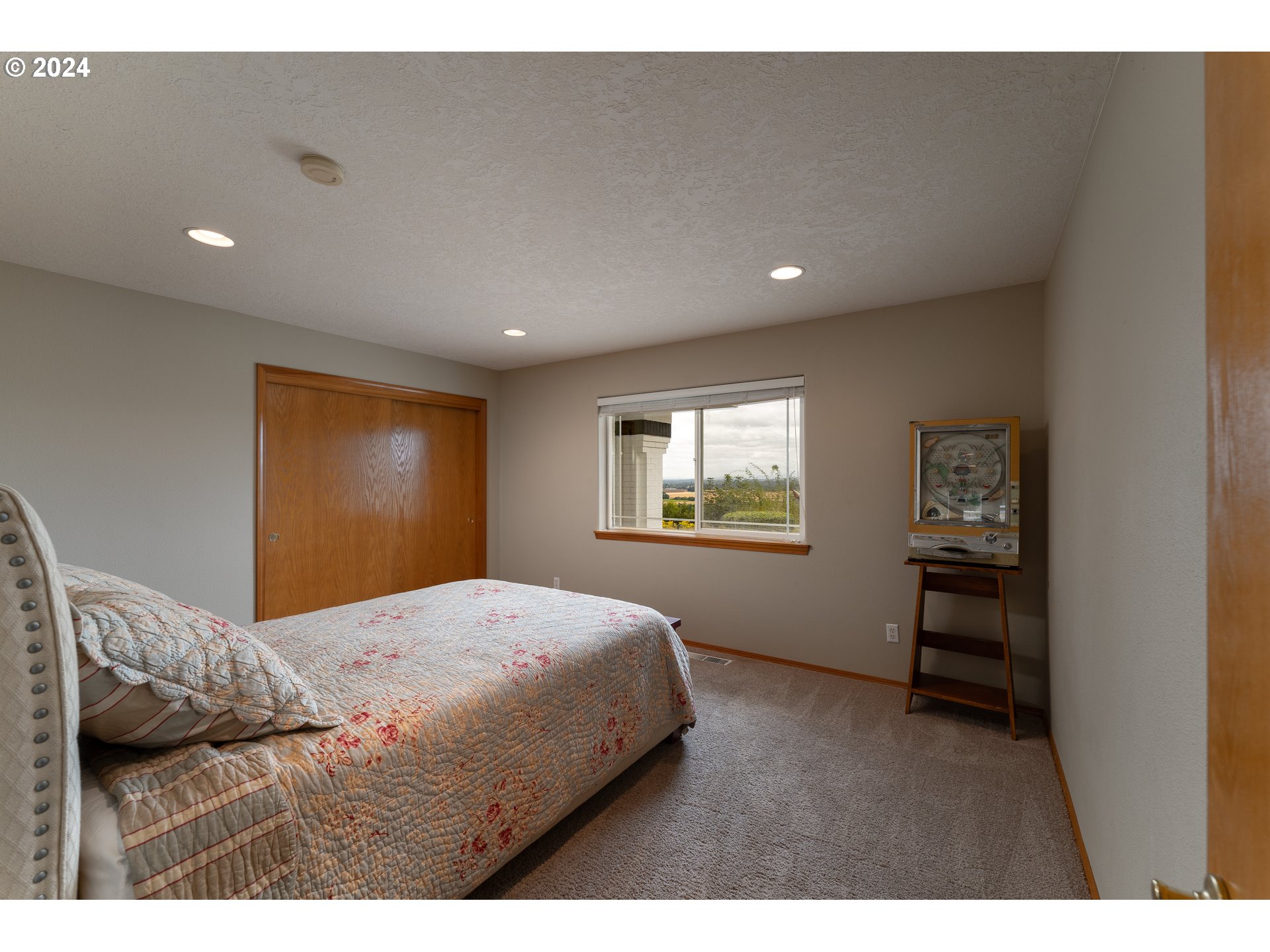15680 Northeast Yamhill Road Yamhill, OR 97148 - Photo 29 of 47 a bedroom with a bed and a window
