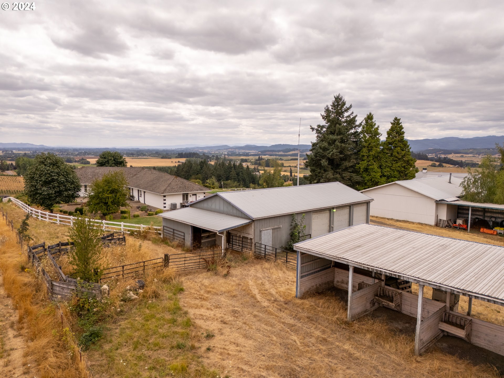 15680 Northeast Yamhill Road Yamhill, OR 97148 - Photo 36 of 47 a view of a dinning table and chairs on the roof deck