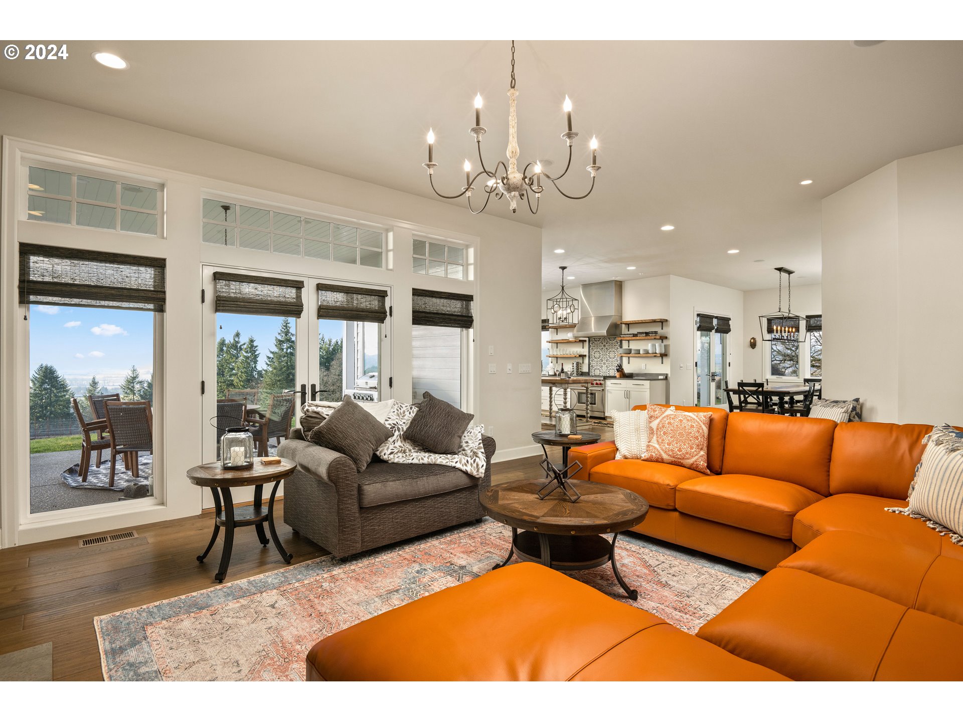 15680 Northeast Yamhill Road Yamhill, OR 97148 - Photo 5 of 47 a living room with furniture a chandelier and a dining table