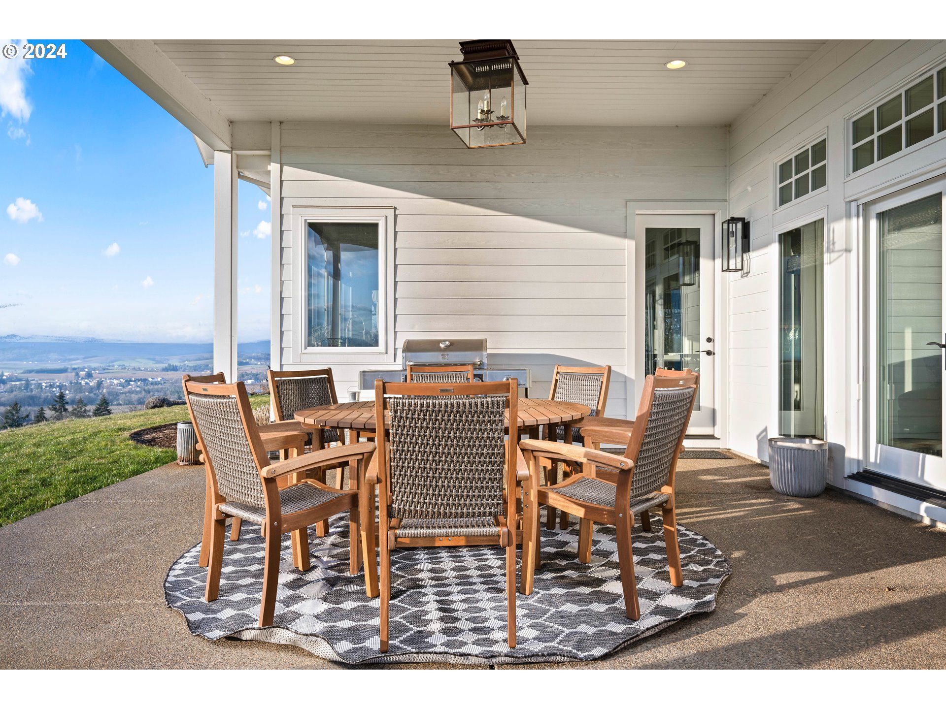 15680 Northeast Yamhill Road Yamhill, OR 97148 - Photo 6 of 47 a view of a dinning table and chairs in the patio