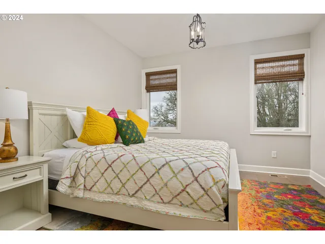 a bedroom with a bed and window