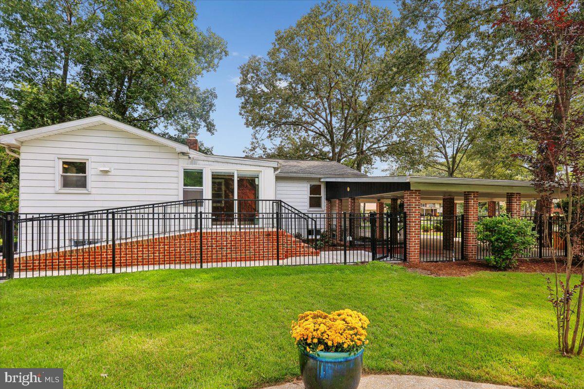 833 Meadow Road Severn, MD 21144 - Photo 41 of 46 Exterior - Rear from Pool Area - Ramp to Back Door