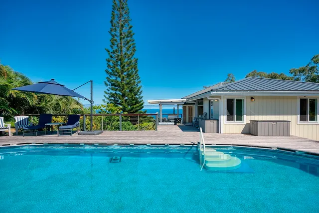 a view of a house with a yard porch and sitting area