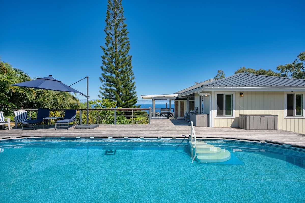 a view of a house with a yard porch and sitting area
