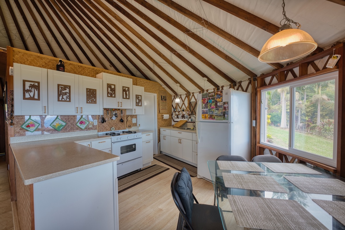 35-1655 Maulua Nui Road Papaaloa, HI 96780 - Photo 21 of 30 a kitchen with stainless steel appliances granite countertop a sink and cabinets