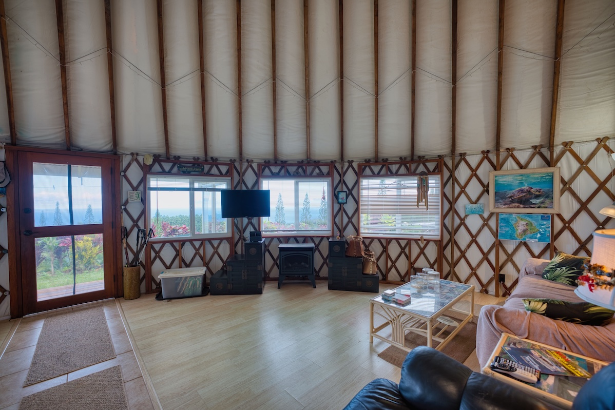 35-1655 Maulua Nui Road Papaaloa, HI 96780 - Photo 22 of 30 a living room with furniture and a floor to ceiling window