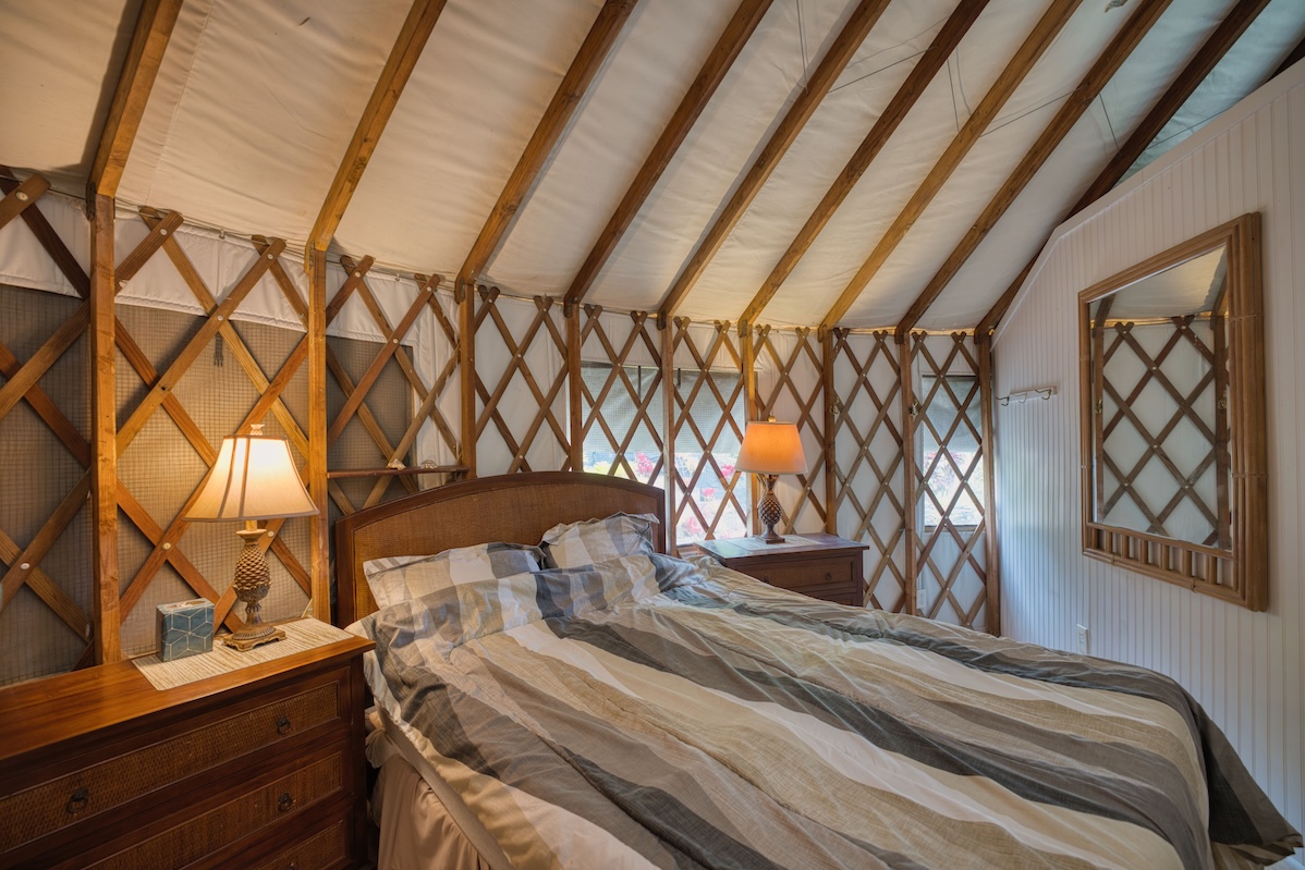 35-1655 Maulua Nui Road Papaaloa, HI 96780 - Photo 24 of 30 a bedroom with a bed and wooden floor