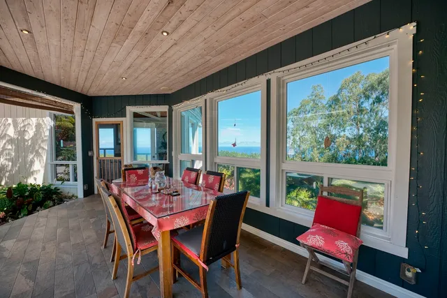 a outdoor dining space with furniture and garden view