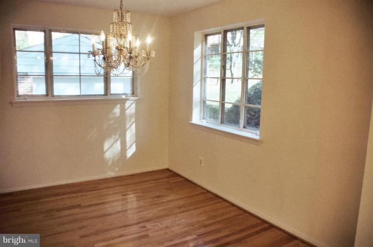 7426 Flora Street Springfield, VA 22150 - Photo 6 of 16 a view of empty room with wooden floor and fan