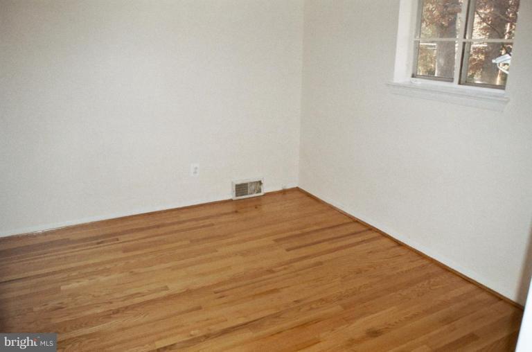 7426 Flora Street Springfield, VA 22150 - Photo 9 of 16 a view of empty room with wooden floor