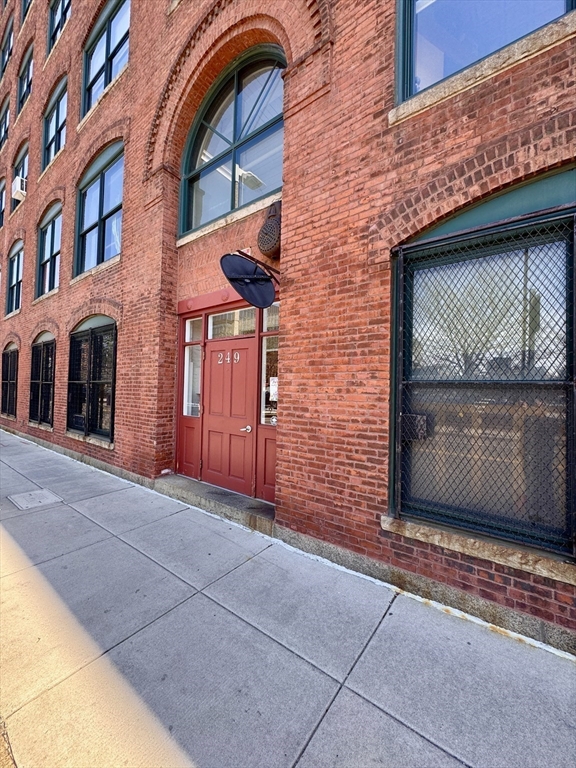 249 A Street, Unit 61 Boston, MA 02210 - Photo 15 of 21 a view of a brick house with a door