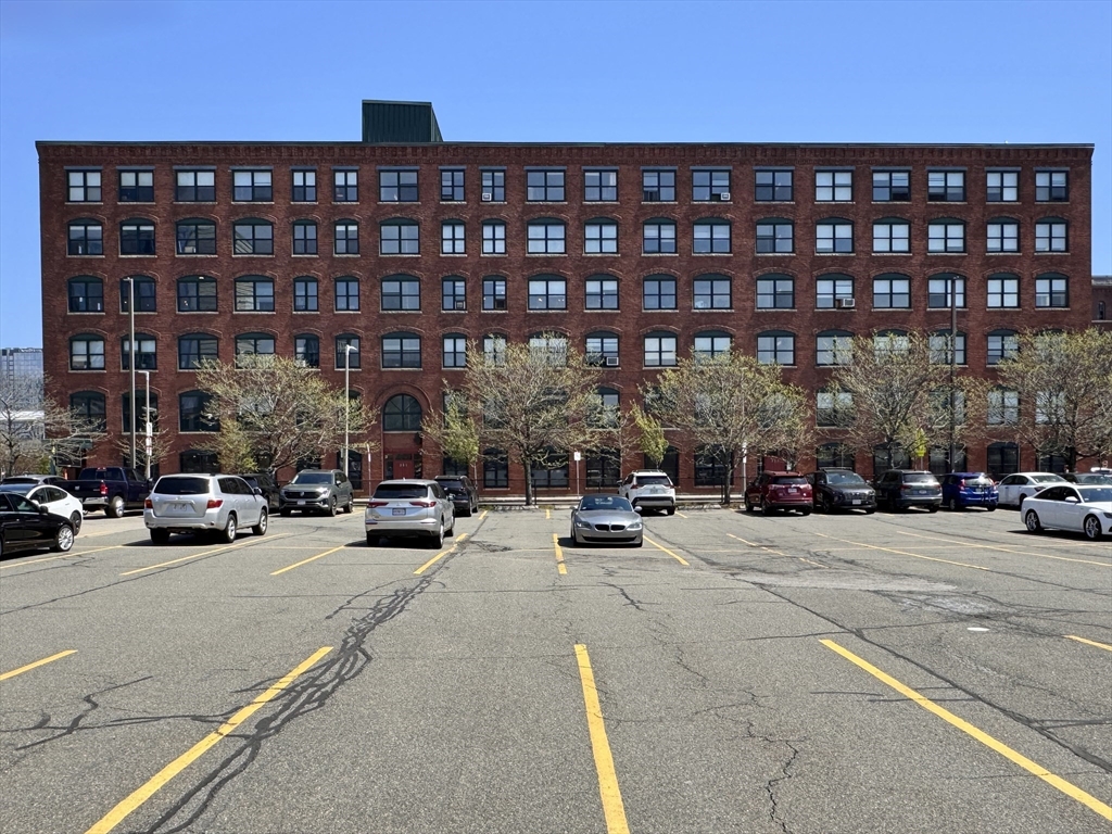 249 A Street, Unit 61 Boston, MA 02210 - Photo 10 of 21 a view of a building and car parked