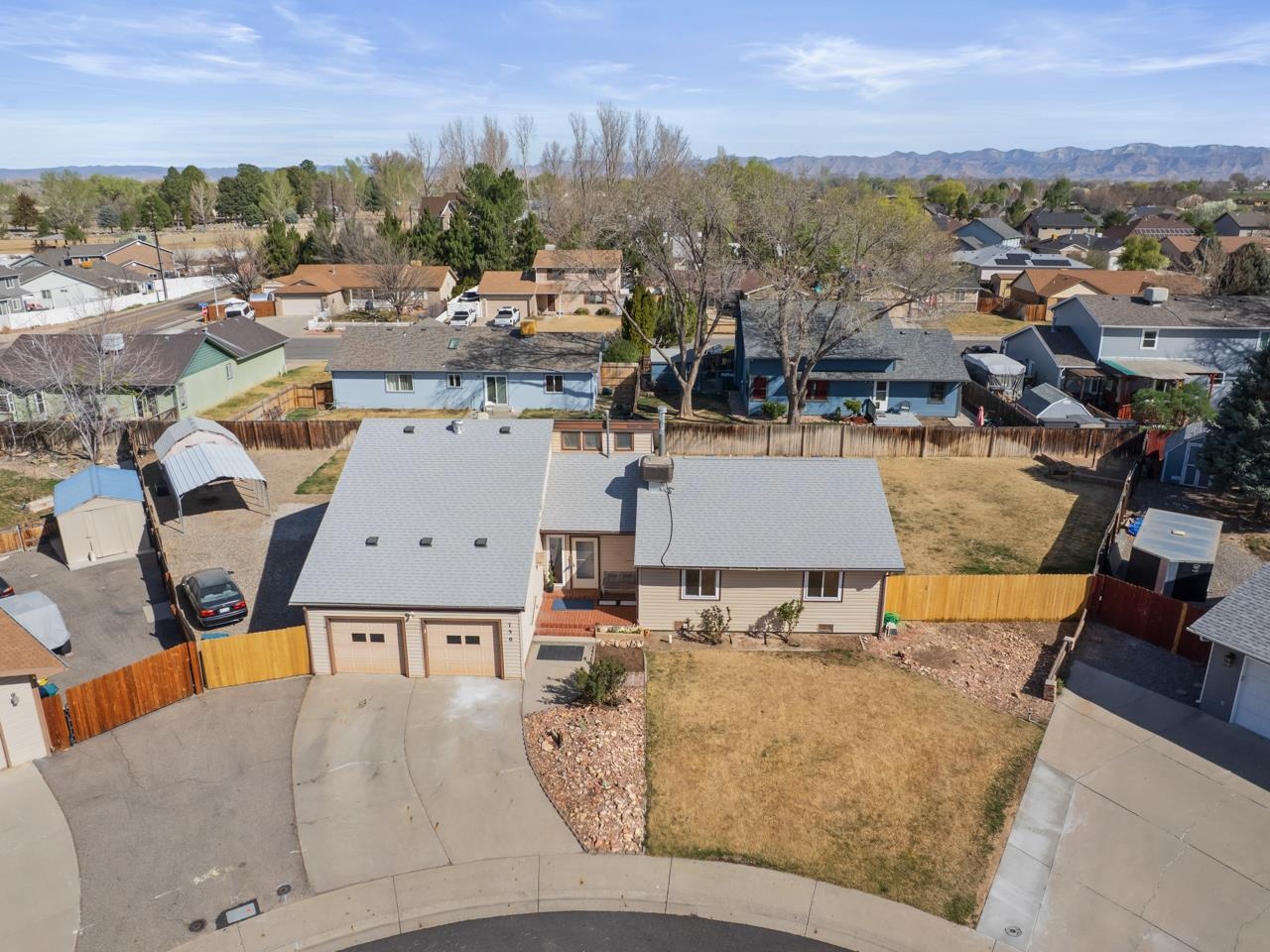 an aerial view of a house with a garden