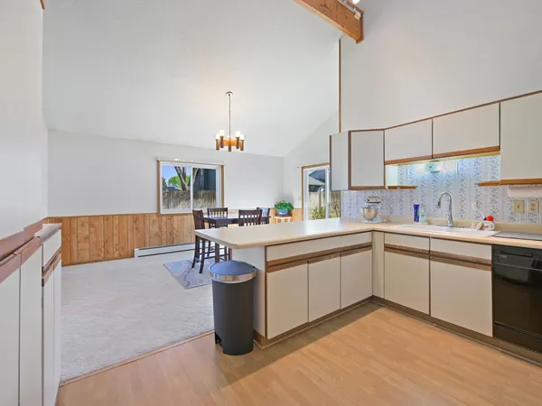 a kitchen with a sink a stove and refrigerator