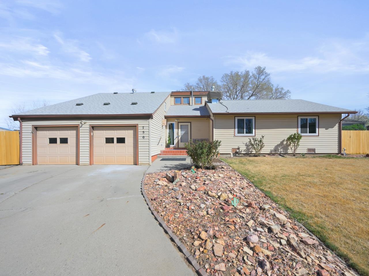 750 Pinyon Court Fruita, CO 81521 - Photo 2 of 40 a front view of a house with garden