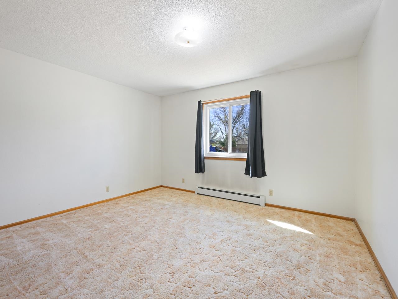750 Pinyon Court Fruita, CO 81521 - Photo 22 of 40 an empty room with windows