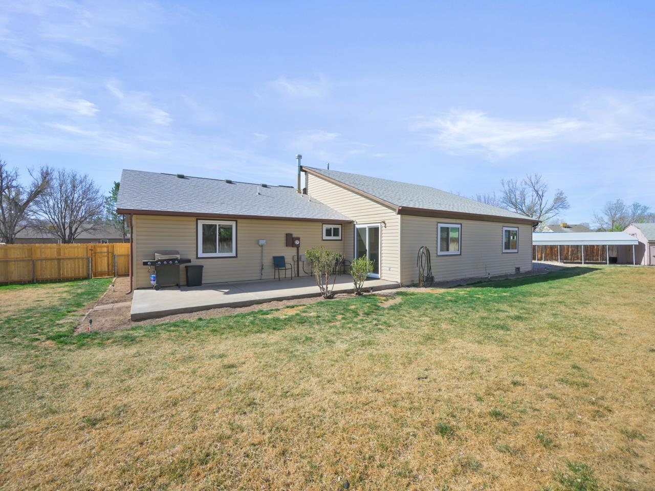 750 Pinyon Court Fruita, CO 81521 - Photo 30 of 40 a view of a house with backyard and garden