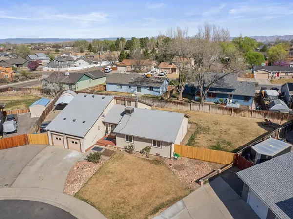 an aerial view of residential houses with outdoor space
