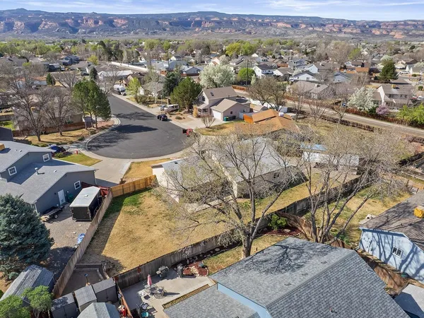 an aerial view of a house with a swimming pool