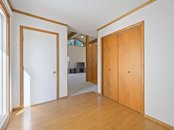 a view of a livingroom with an empty space and a fireplace