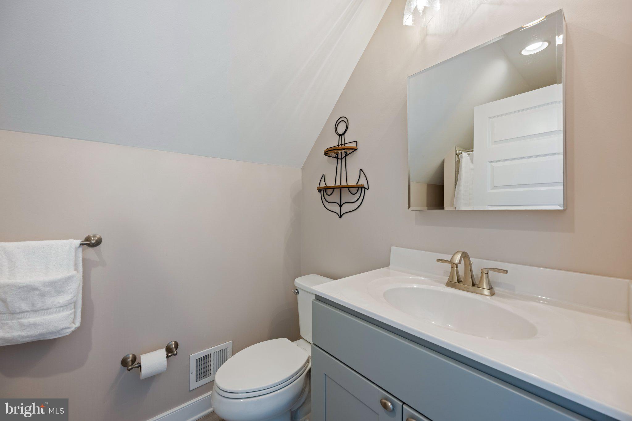 402 Salt Pond Road Bethany Beach, DE 19930 - Photo 43 of 55 Charming nautical-themed bathroom retreat.