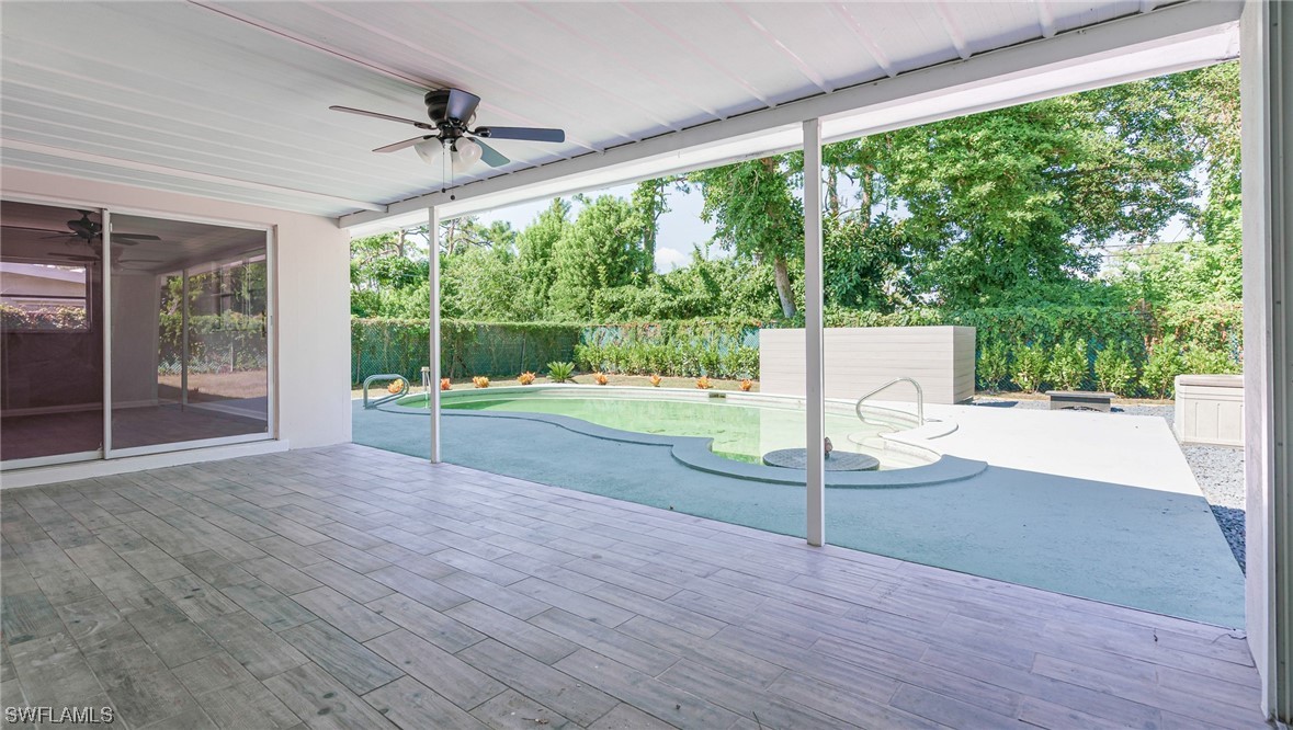 8631 Exeter Street Fort Myers, FL 33907 - Photo 19 of 23 a view of a room with wooden floor and outdoor space