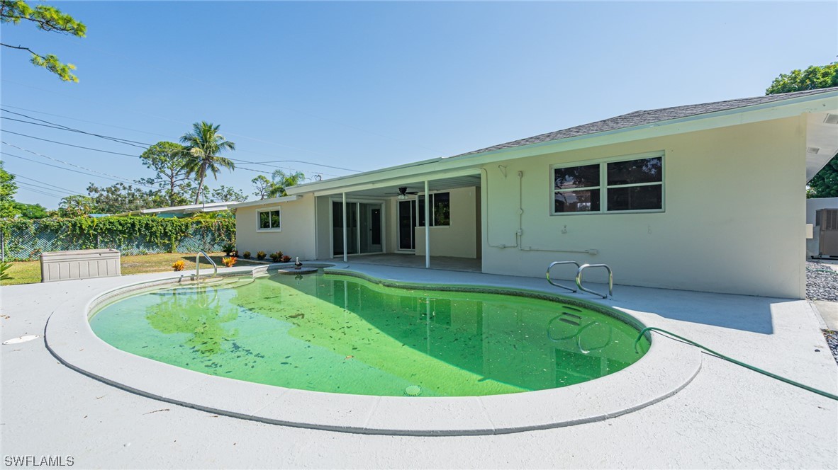 8631 Exeter Street Fort Myers, FL 33907 - Photo 22 of 23 a view of outdoor space yard swimming pool and porch