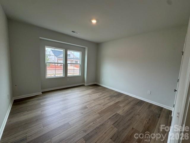 206 Rodeo Drive Shelby, NC 28150 - Photo 5 of 19 an empty room with wooden floor and windows