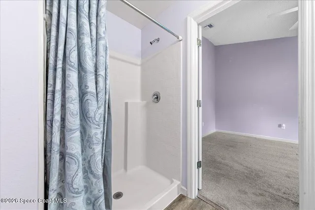 a bathroom with a shower and a tub