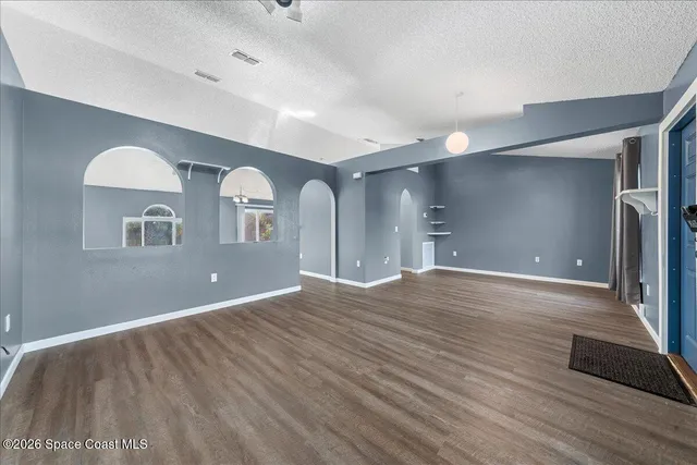 a view of a livingroom with wooden floor