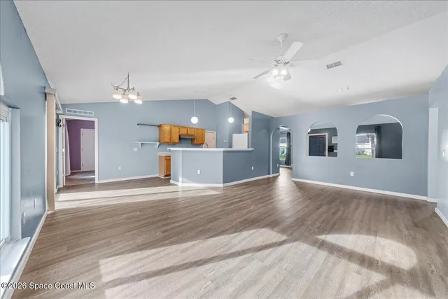 a view of a kitchen with a sink and a chandelier