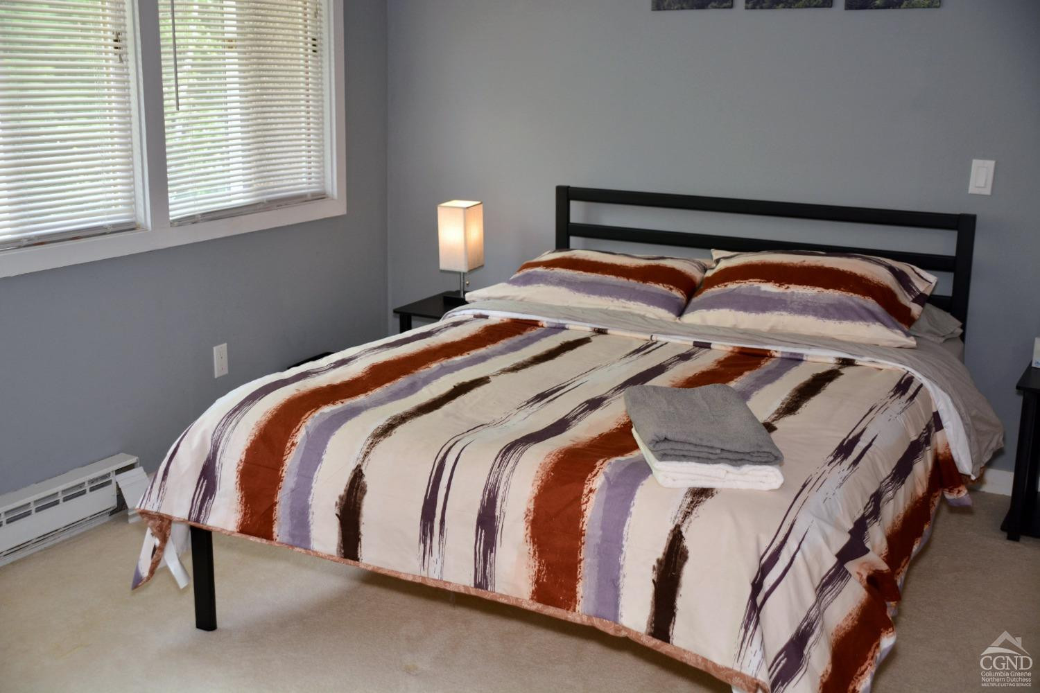 81 Scribner Hollow Road, Unit D 2 Hunter, NY 12442 - Photo 11 of 36 a bedroom with a bed and window