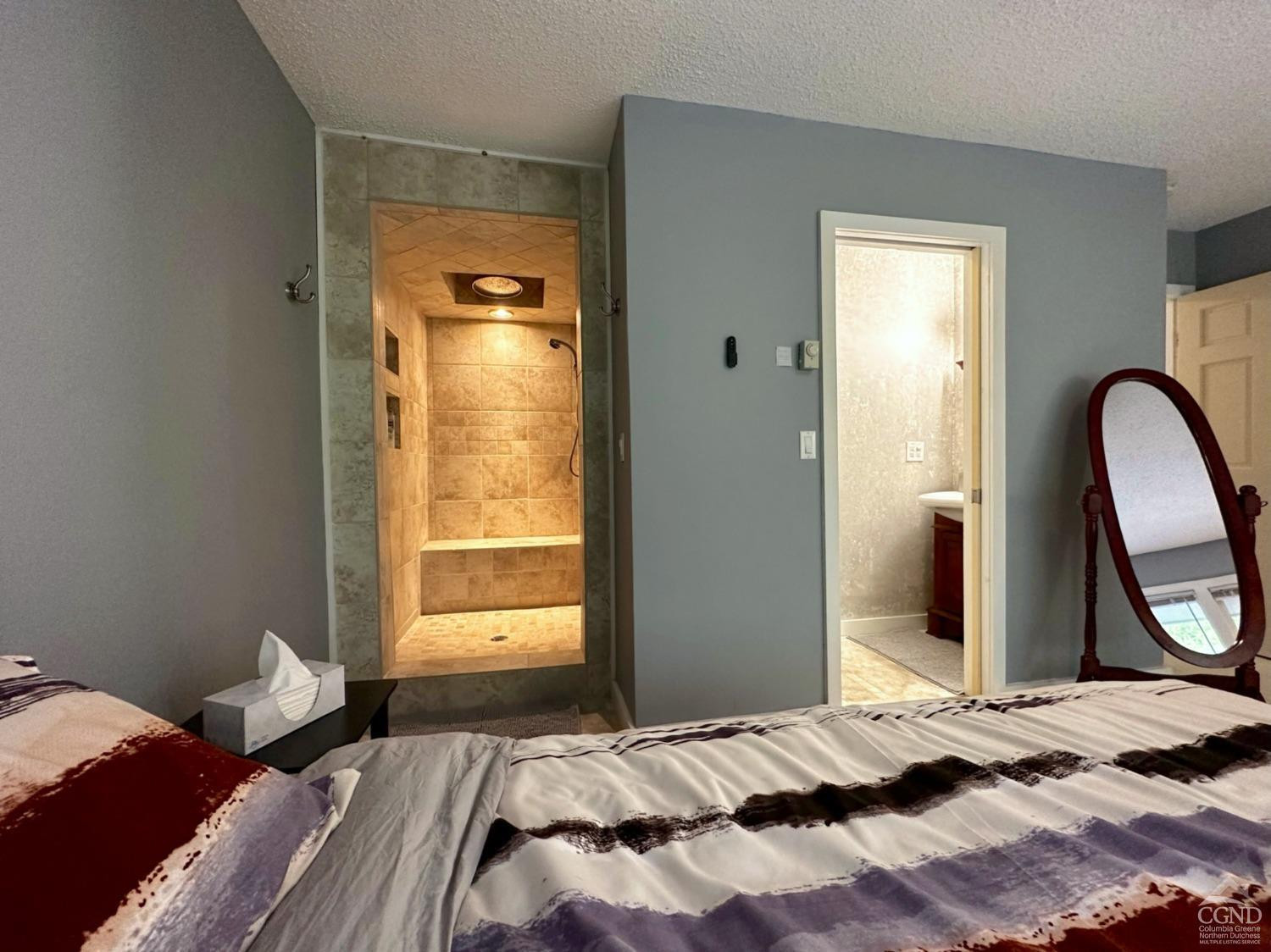 81 Scribner Hollow Road, Unit D 2 Hunter, NY 12442 - Photo 12 of 36 a bedroom with a bed and a window