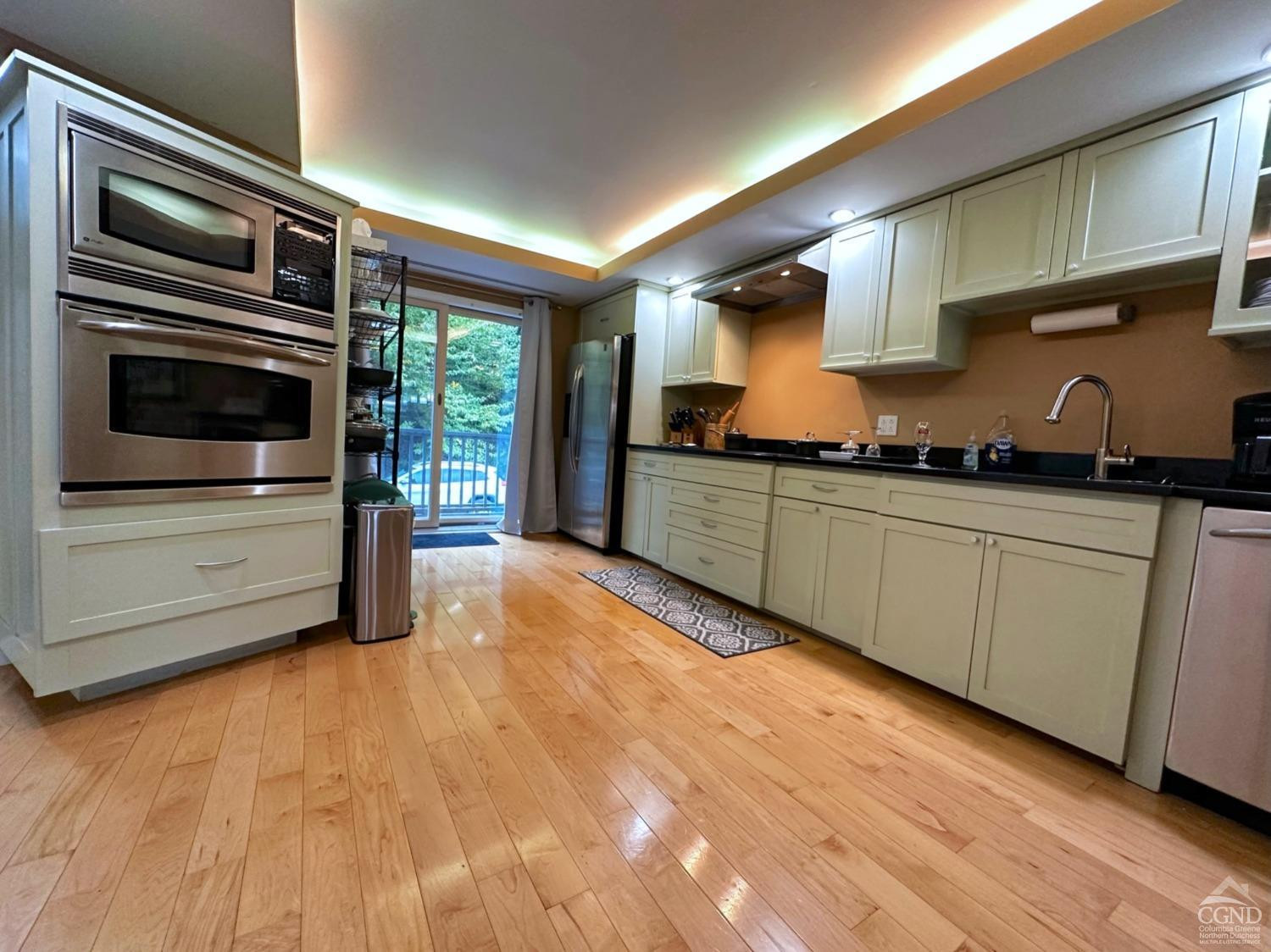 81 Scribner Hollow Road, Unit D 2 Hunter, NY 12442 - Photo 6 of 36 a kitchen with stainless steel appliances granite countertop a stove and a sink