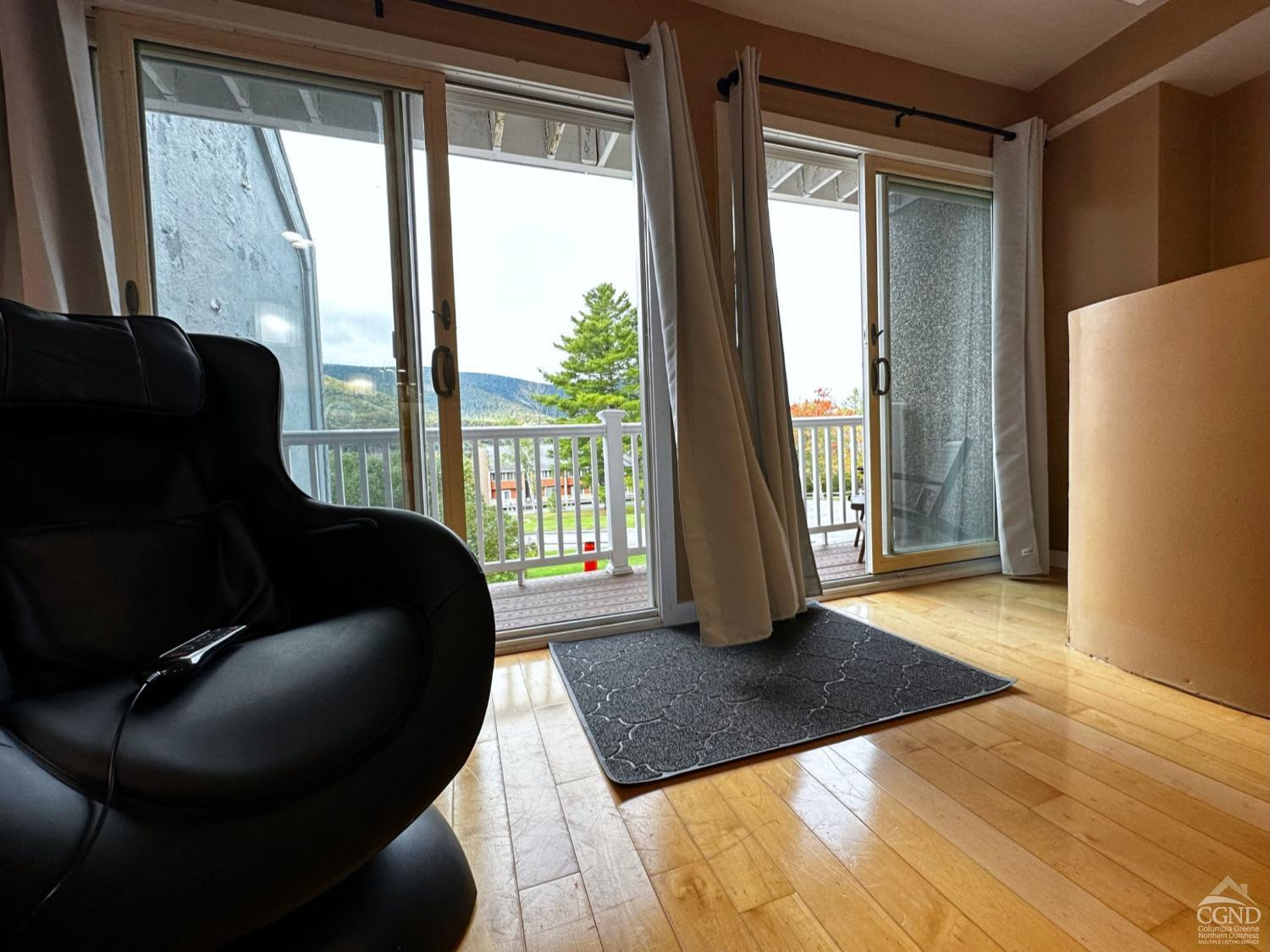 81 Scribner Hollow Road, Unit D 2 Hunter, NY 12442 - Photo 8 of 36 a living room with furniture and a floor to ceiling window