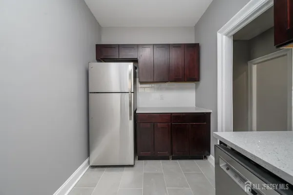 a refrigerator freezer sitting in a kitchen
