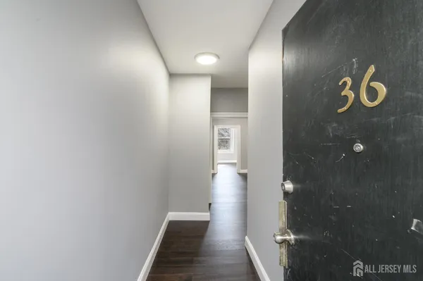 a view of hallway with mirror